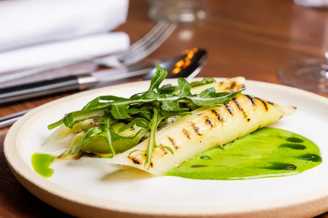 Grilled leeks, matcha sauce and pistachio praline