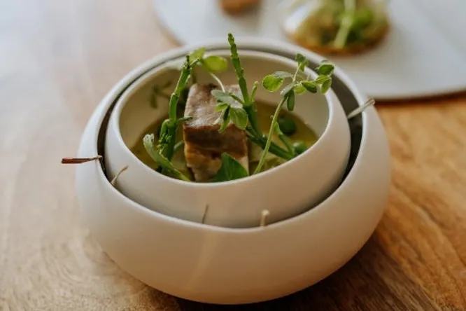 Rack of pork, creamy peas & andouille tartlet