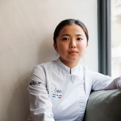 Den Mi Kim