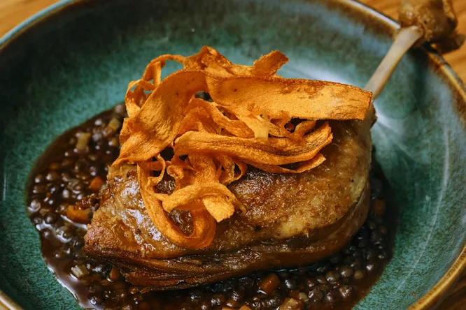 Duck legs confit, Puy lentils, spicy jus