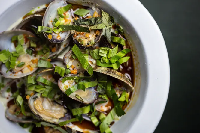 Coconut clams with green curry and Thai herbs